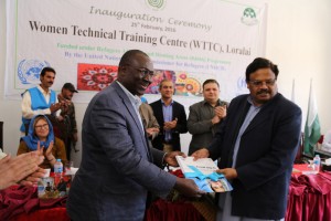 UNHCR’s Assistant High Commissioner Mr. George Okoth-Obbo presenting handover documents to Hamid ul Karim, Secretary Labour and Manpower at the inauguration ceremony of the Women Technical Training Centre in Loralai district in Balochistan on Thursdsay. (c) UNHCR/Q.K.Afridi