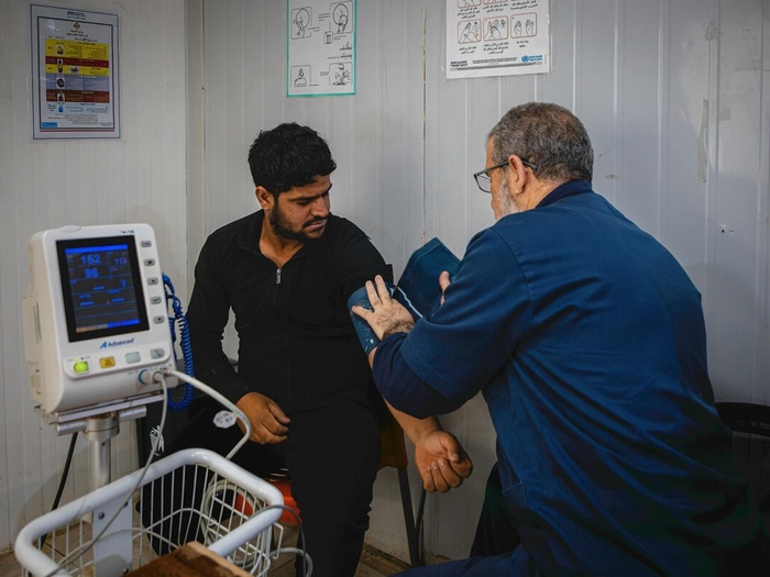 A doctor provides healthcare in Jordan.