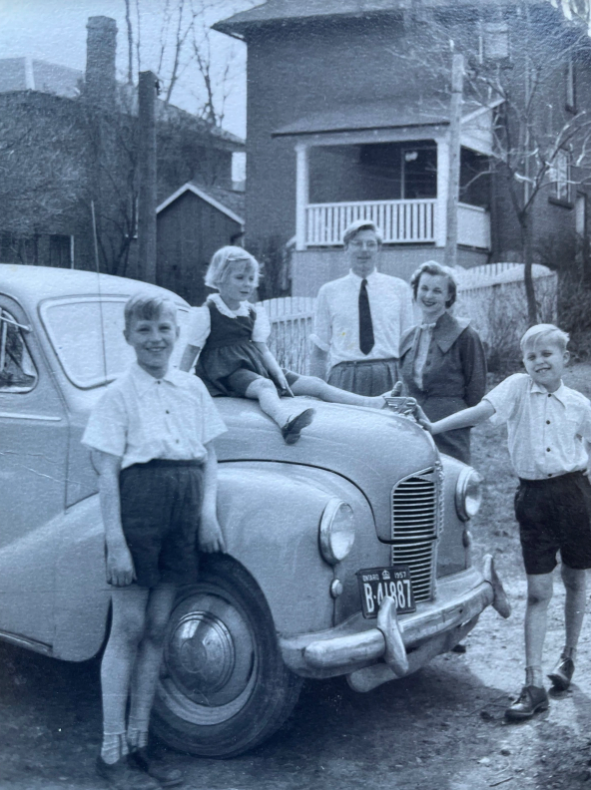 Family portrait in front of their house in Canada