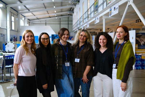 A team taking a picture in UNHCRs Community Centre in Bucharest, Romania