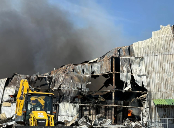 A warehouse contracted by UNHCR in Ukraine burning down because of a Russian drone strike