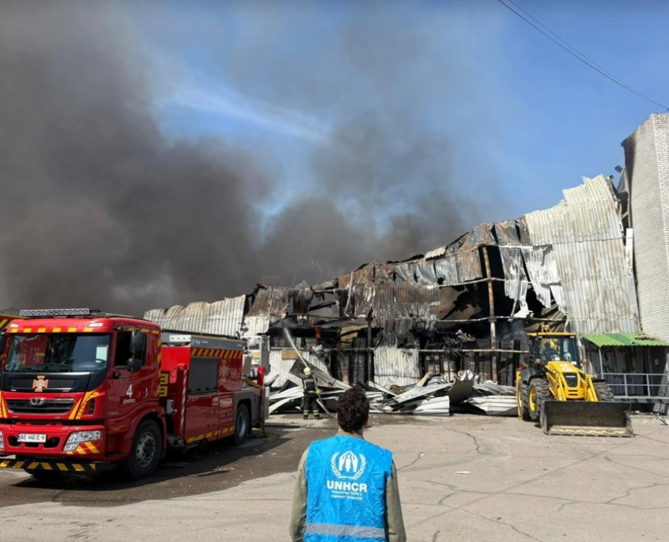 A warehouse contracted by UNHCR in Ukraine burning down due to a Russian drone strike