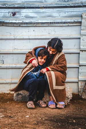 Jordan. Smiling Through the Harsh Winter in Zaatari camp.