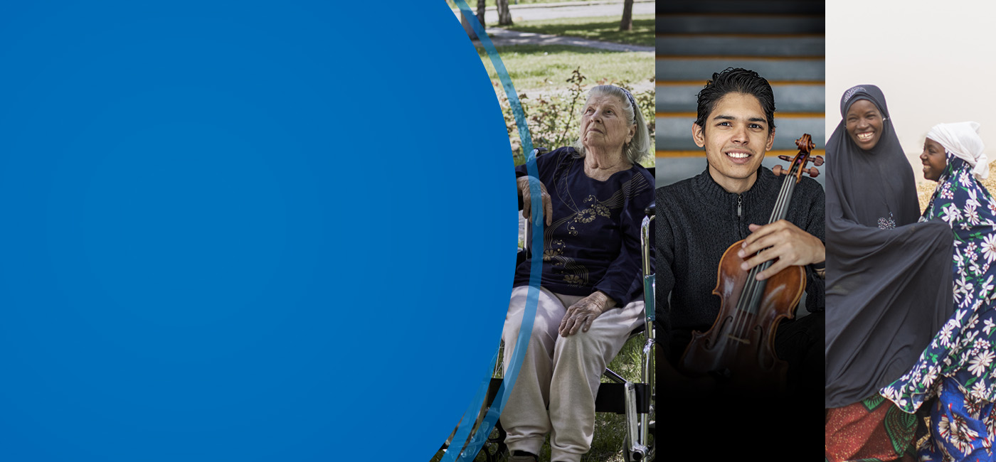 Three refuges smile for the camera. One holds a violin, another is in medical scrubs.