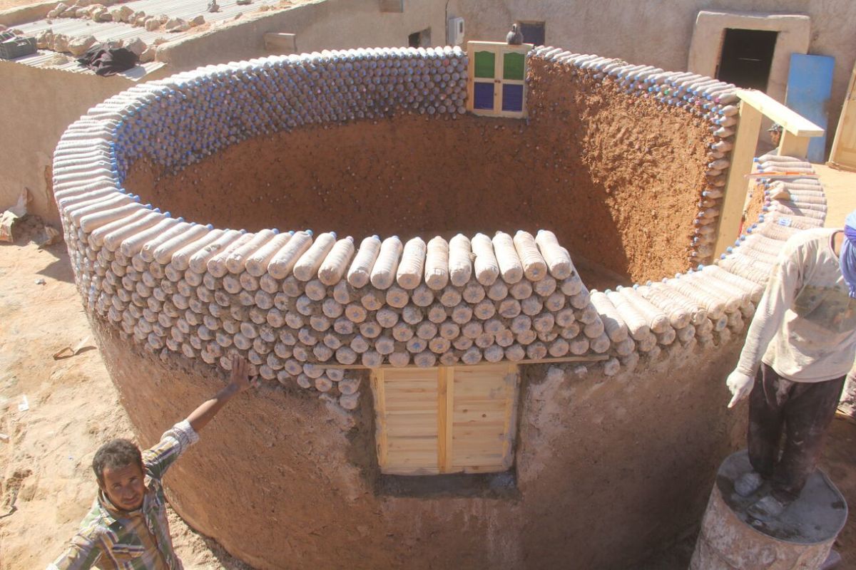 Algeria. Bottling sand to build better shelters for refugees