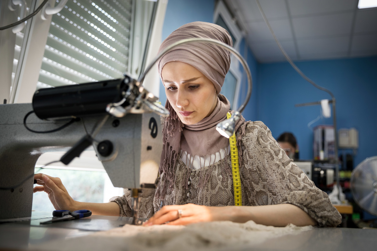 Germany. Refugee women got a job as a seamstress in a Frankfurt fashion workshop.