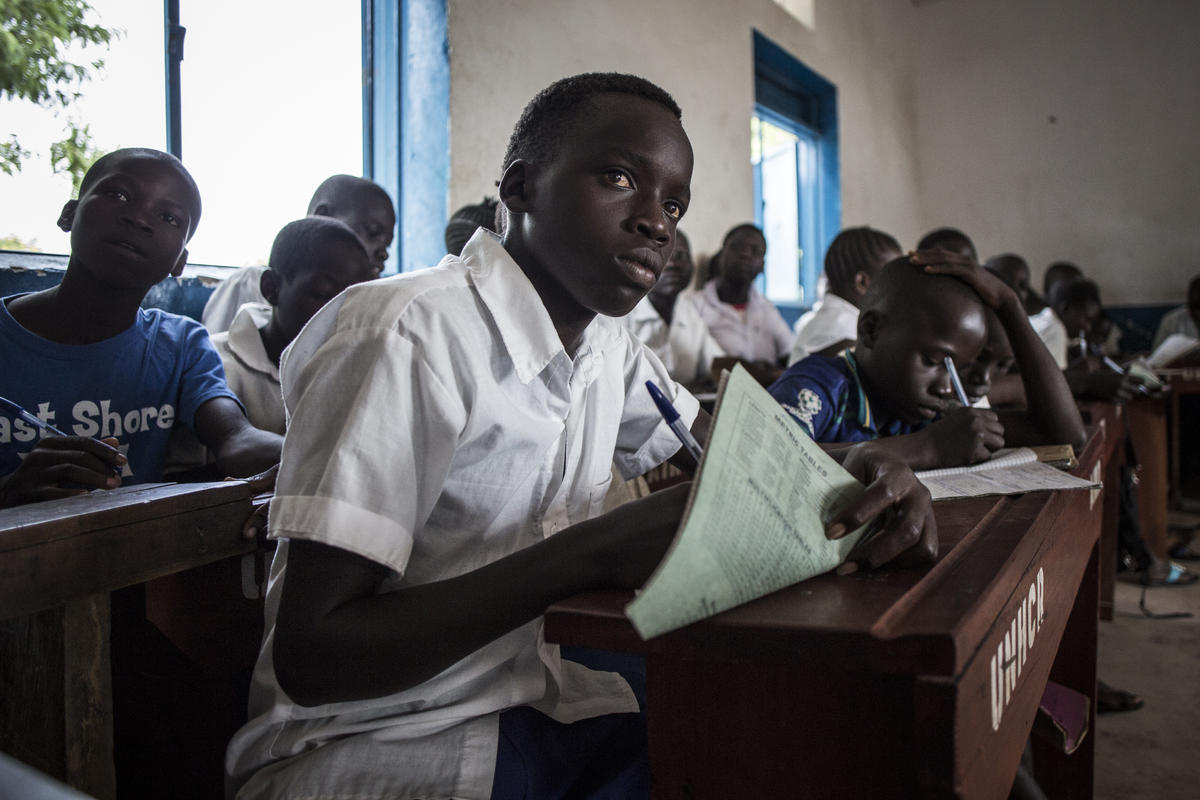A young South Sudanese refugee student learning