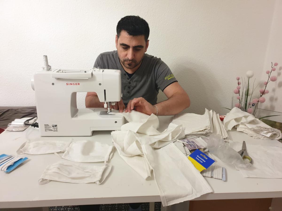 Germany. Syrian family in Germany is sewing face masks
