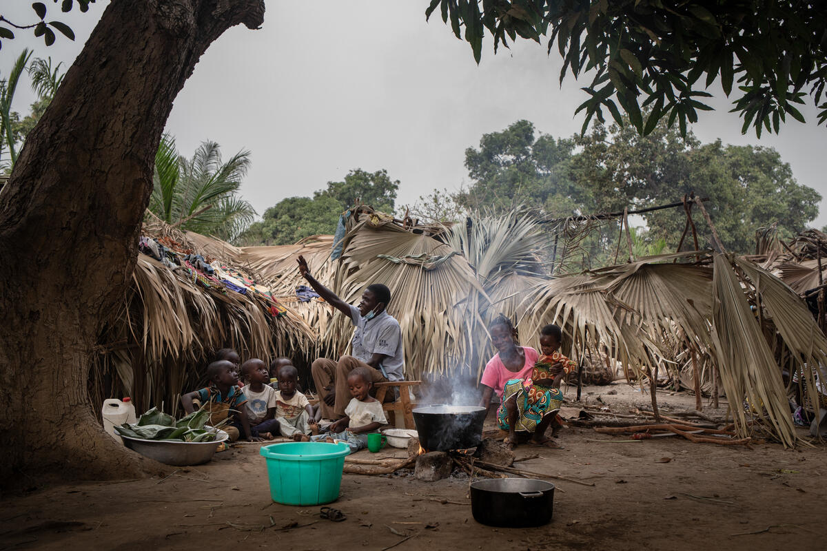 Democratic Republic of the Congo. A refugee family prepares food