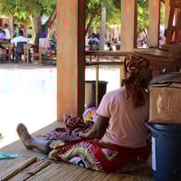 A woman displaced by the recent flooding finds shelter at a school in Xai-Xai, in Mozambique's Gaza Province.