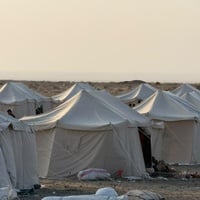 White tents in a camp for displaced people