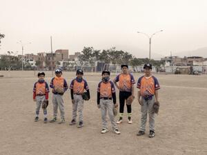 Members of Los Astros youth baseball club attend training in a park in Lima, Peru.