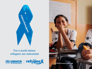 On the right, a picture of two young girls smiling and sitting at their desks in a classroom. On the left, a blue ribbon with the inscription "With Refugees". Text under the ribbon reads: "For a world where refugees are welcome".