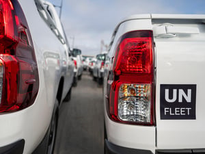 Close up of two UN FLEET vehicles, pictured from behind