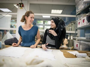 Germany. Refugee women got a job as a seamstress in a Frankfurt fashion workshop.