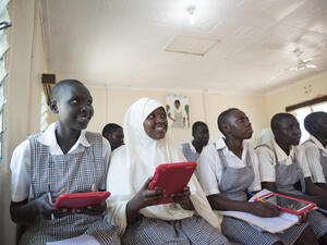 Kenya. Mary and Mumina use tablets in Class 8 at Angelina Jolie School