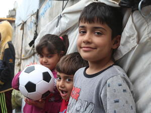Iraq. Displaced family given shelter on return to damaged village