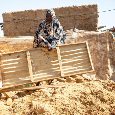 Niger. A malian refugee in the ruins of her home that was swept away by flood waters