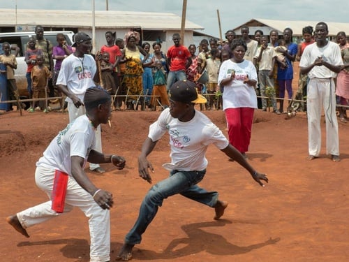 Central African refugees practice capoiera in front of an audience
