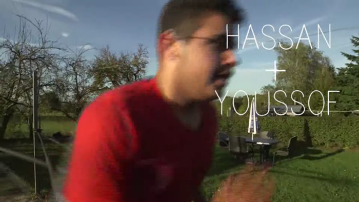 A boy running in a garden.