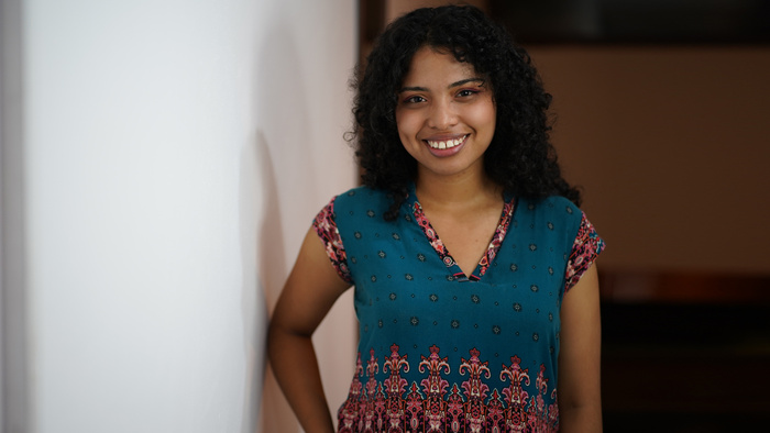 Cristina smiling at the camera