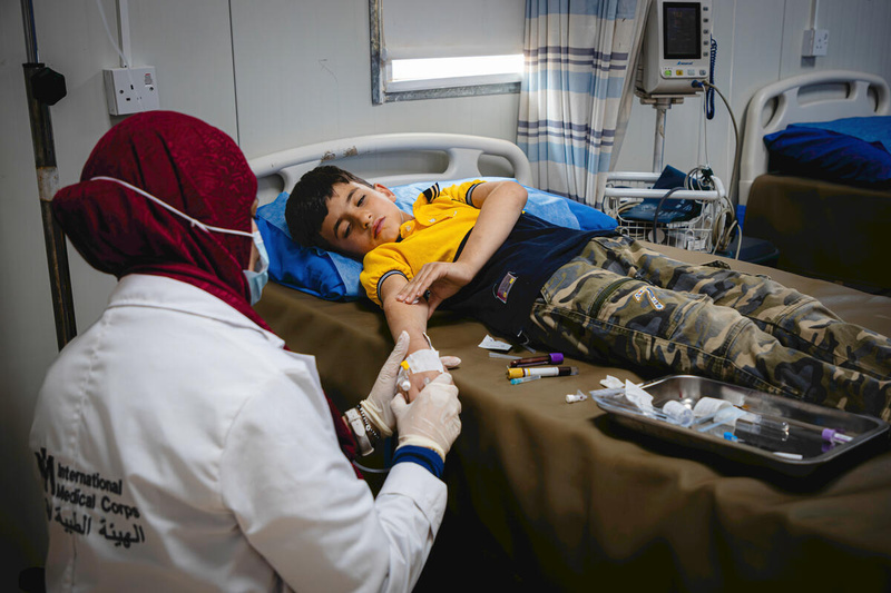 A child sleeping in a hospital bed