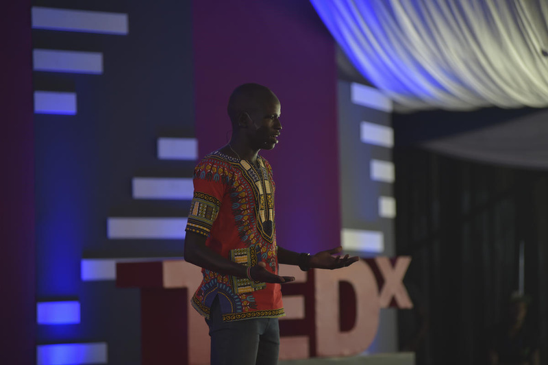 Yiech Pur Biel speaking on stage.