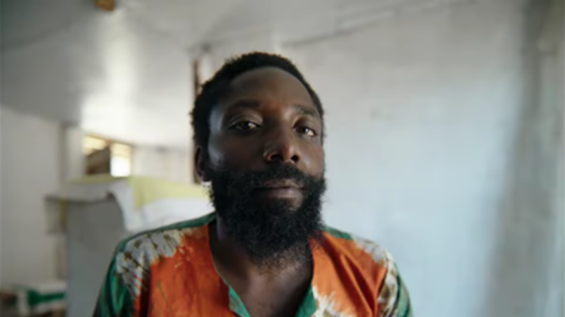 A Congolese man looks at the camera