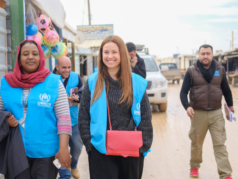 Raya Abirached walking with UNHCR staff members