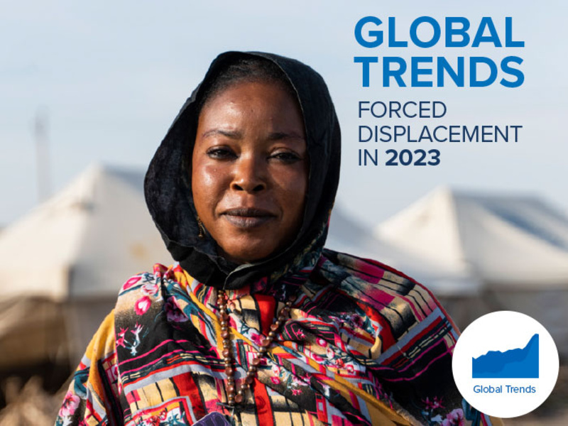 Cover of the Global Trends 2023 report featuring a woman in an IDP camp.