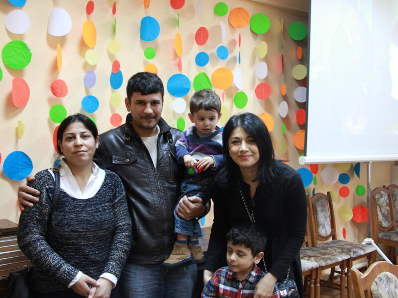 UNHCR Goodwill Ambassador Iskui Abalyan meets a family of resettled refugees in Gomel, Belarus