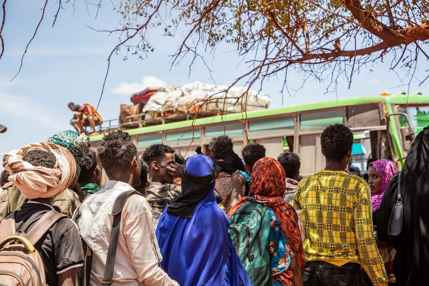 Somali refugees in Goob, Ethiopia, wait to board buses to the Mirqaan settlement.