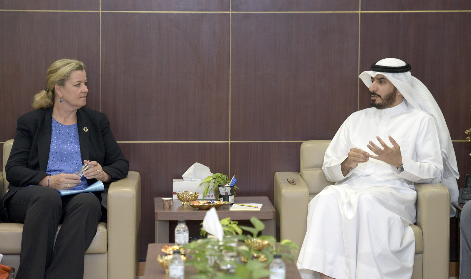 Mr. Majed AlAzmi in conversation with the Deputy High Commissioner, Ms. Kelly T. Clements