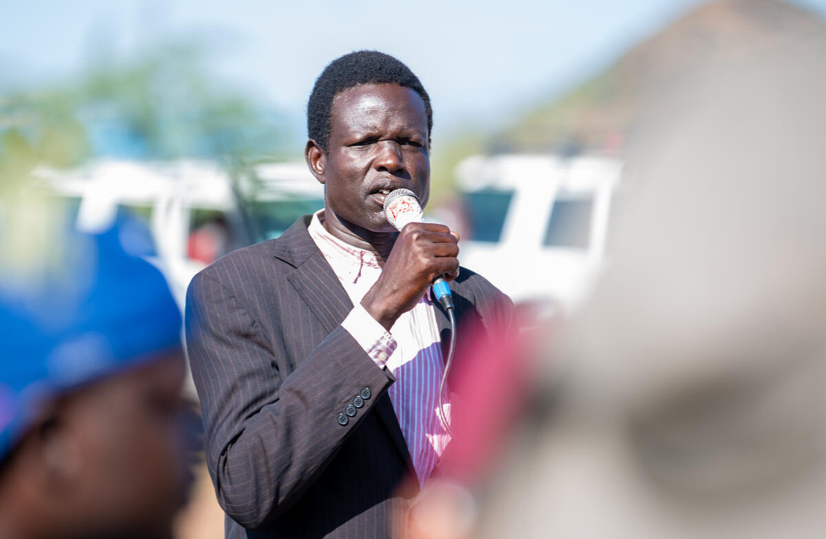 A man speaks into a microphone