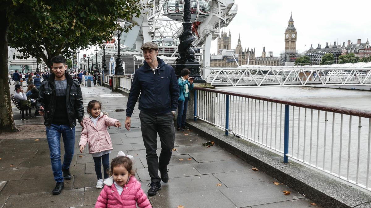David Morrissey walks through London with Jamal and his two young daughters.