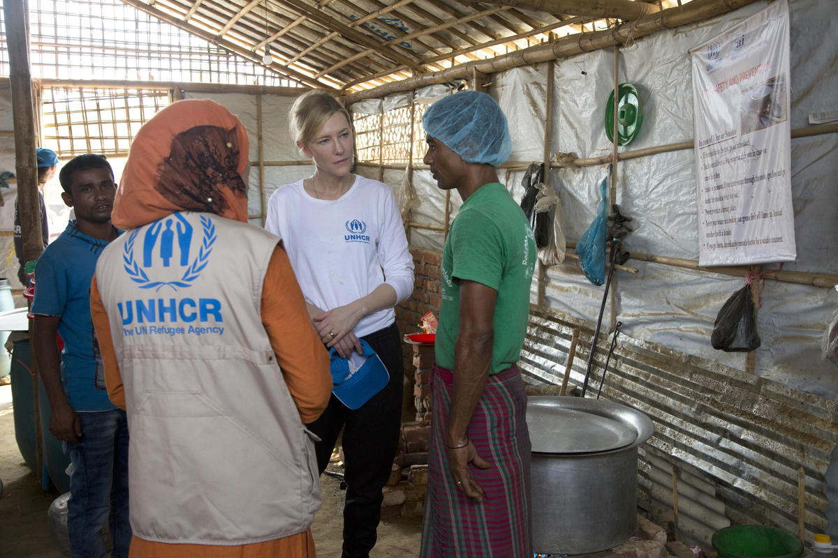 Cate talking with staff in the community kitchen