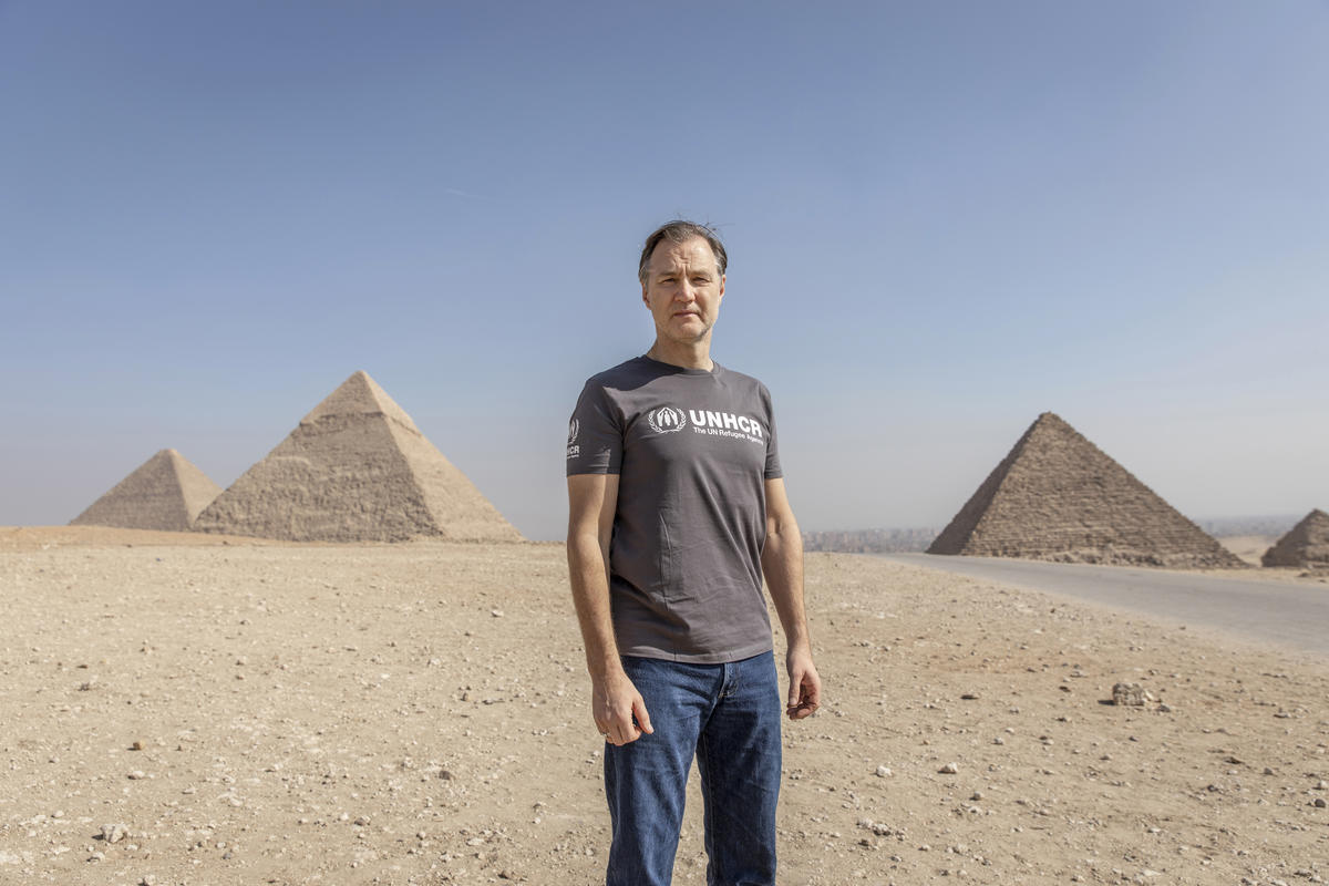 David Morrissey stands in front of the Giza pyramids.