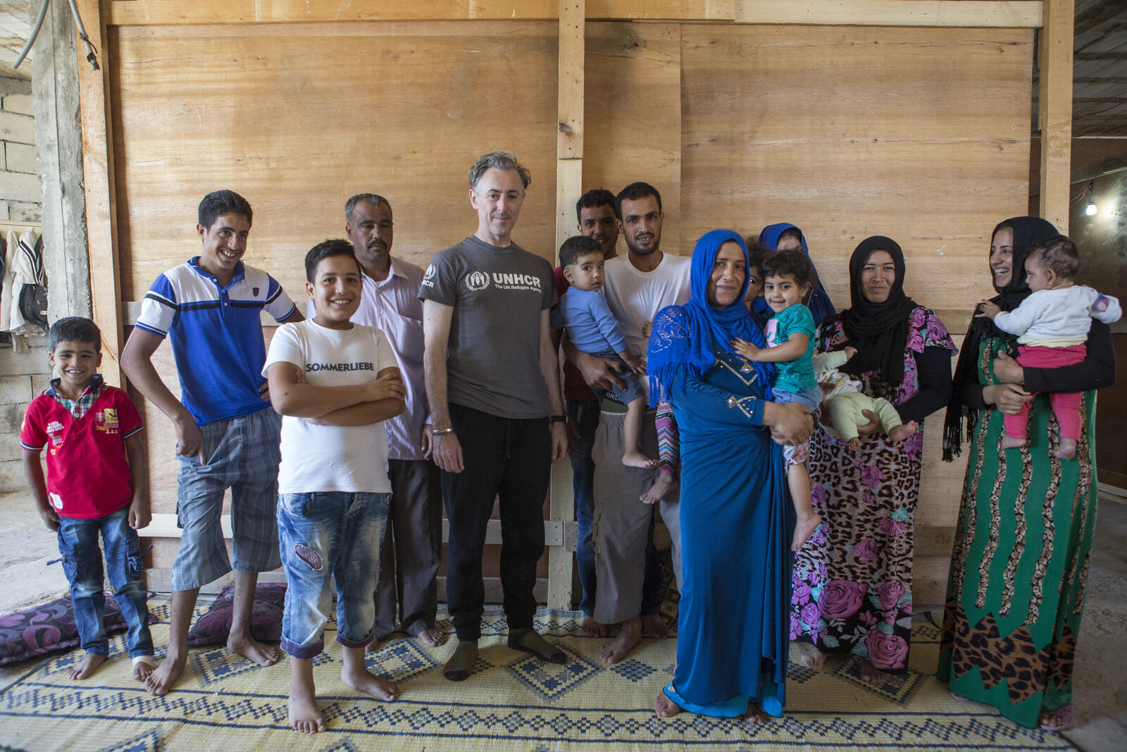 Lebanon. UNHCR High Profile Supporter Alan Cumming meets three Syrian refugee families living together in substandard shelter in Beissarieh in southern Lebanon
