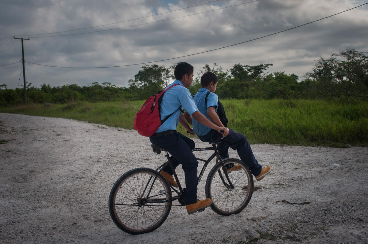 Belize. Daily life of family who fled from gangs violence of El Salvador.