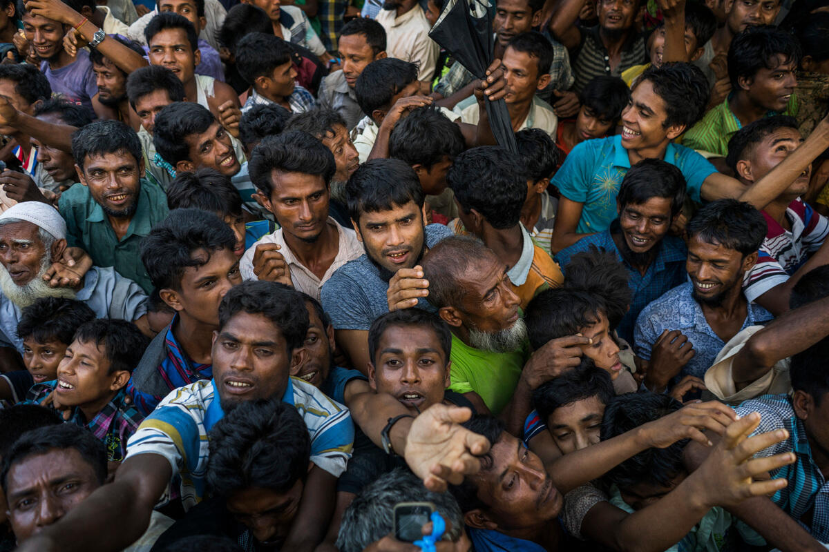 Bangladesh. Rohingya refugees scramble for clothing