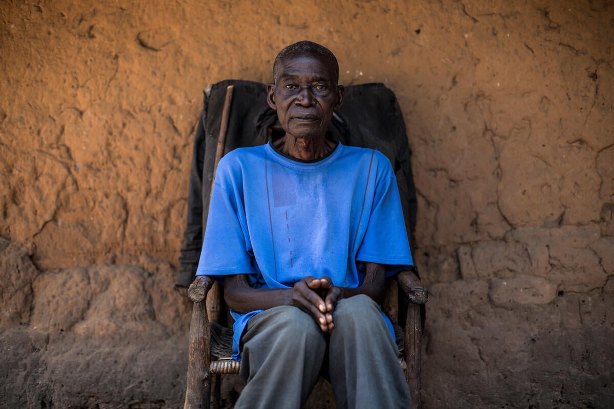 Democratic Republic of Congo. A internally displaced person sits in front of his host house after arriving 3 days before.
