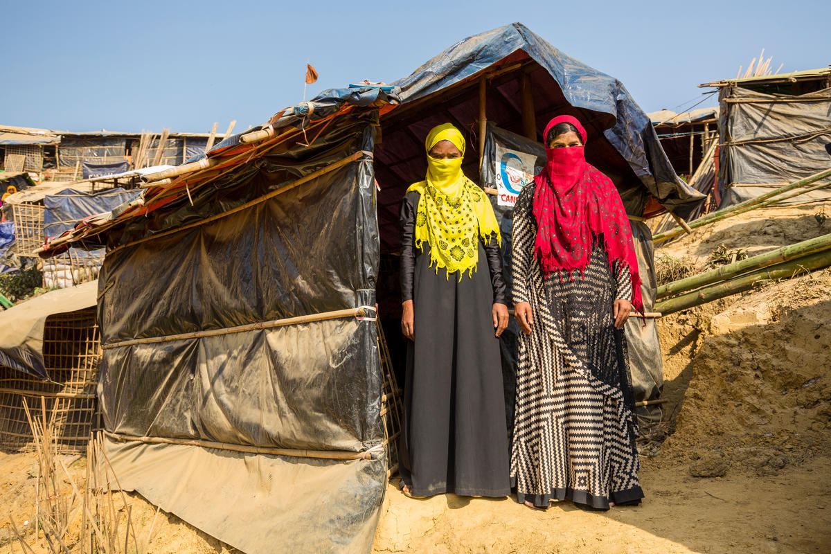 Bangladesh. Female head of households recieve assistance from Community Outreach Volunteers