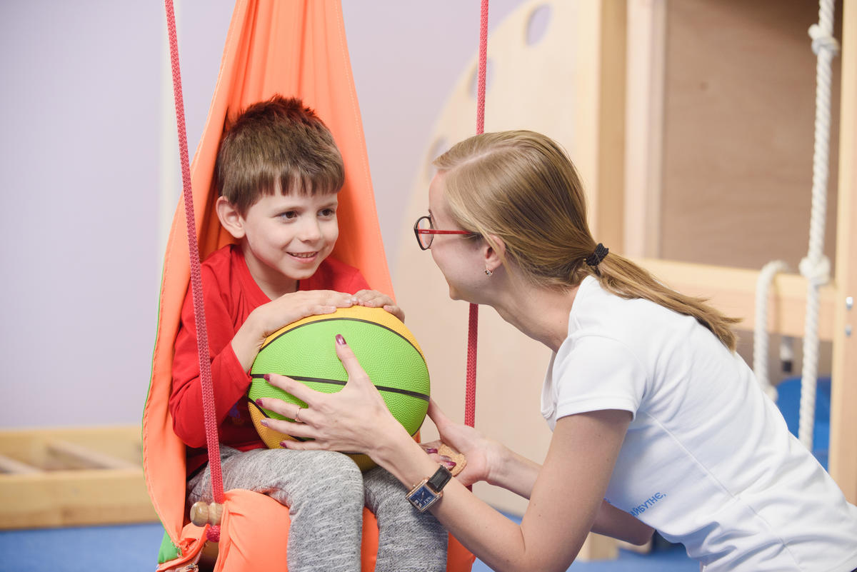 Psychologist works with 6-year-old Vlad Abayev in the centre for children with mental disorders opened by Olena (IDP) in Sumy with support from UNHCR