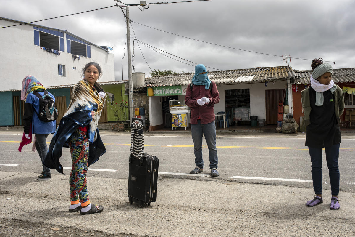 Colombia. Venezuelans get ready to walk across the mountain road
