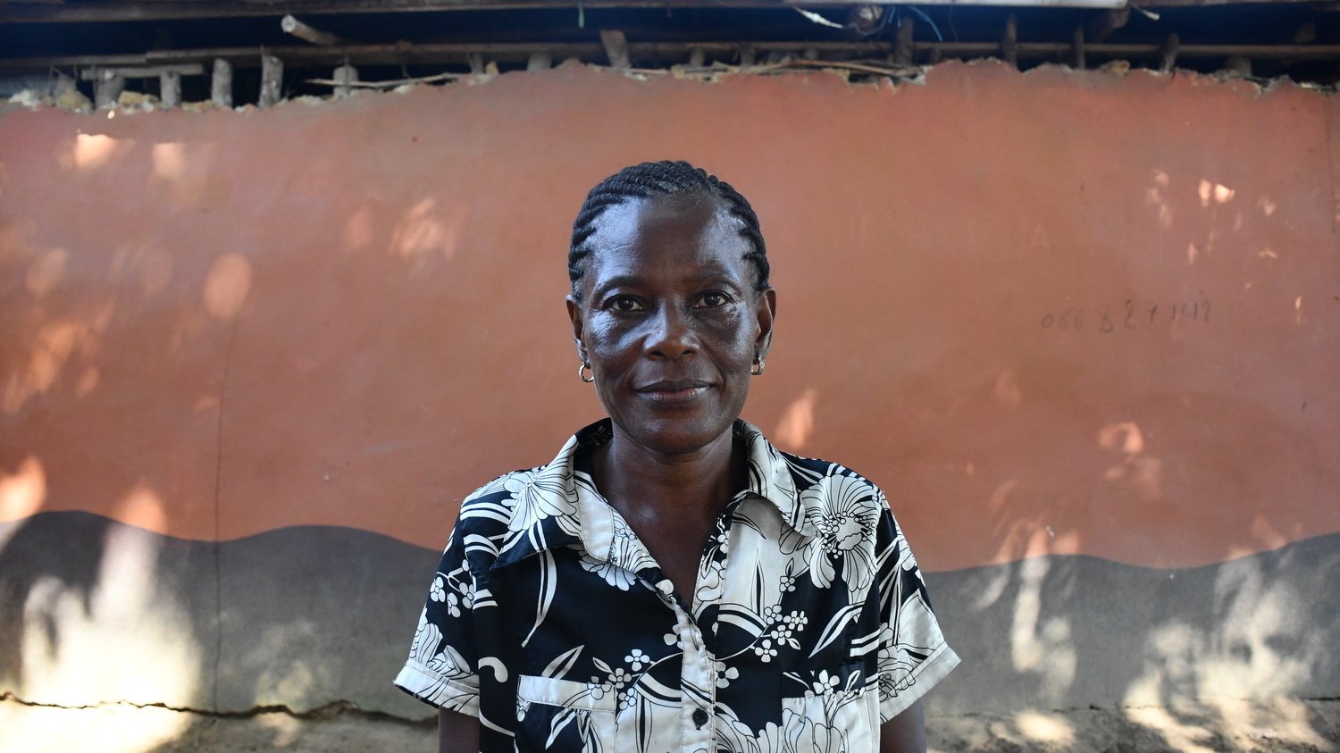 A portrait of a woman wearing a black and white dress.