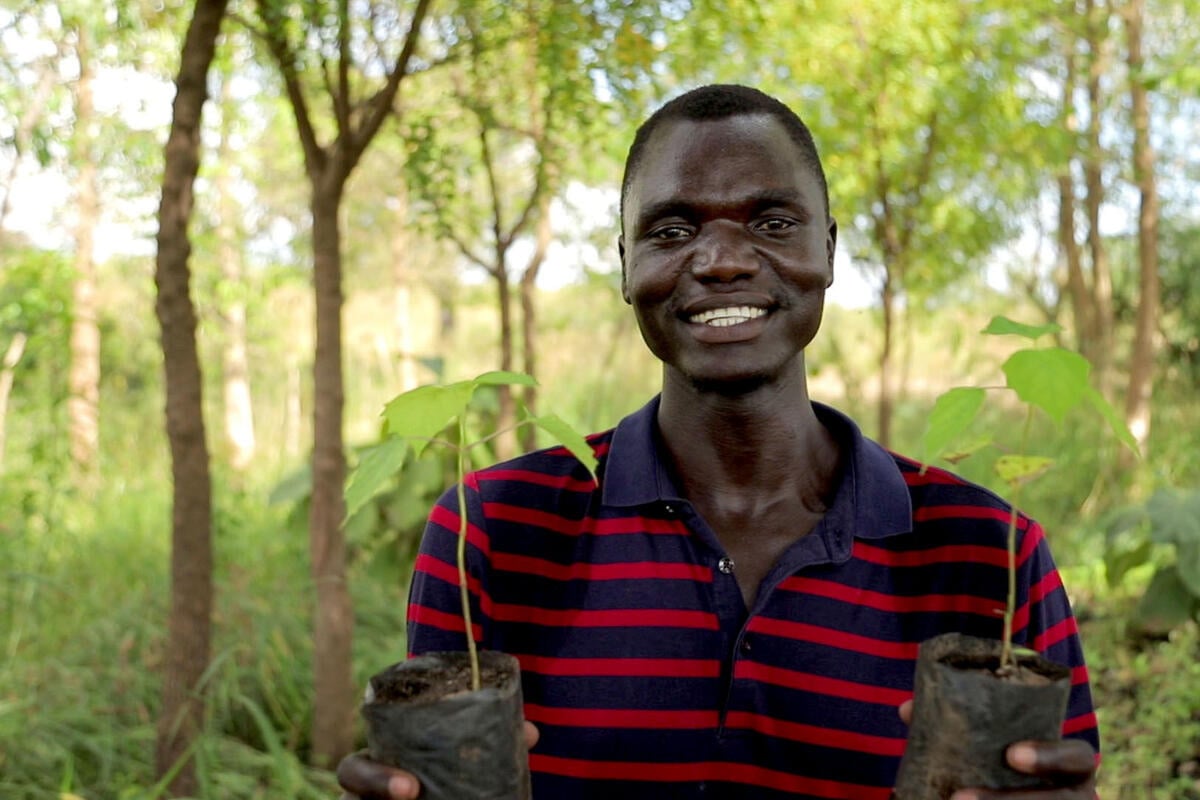 Uganda. South Sudanese refugee plants trees to combat climate change