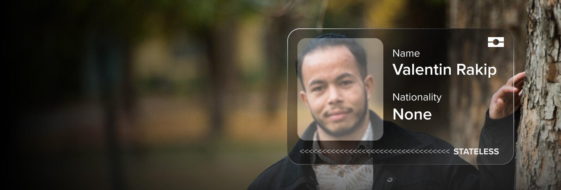 A young man with a graphic of an ID card overlaid on the photo. The card displays the text 'Nationality: None. Stateless.'