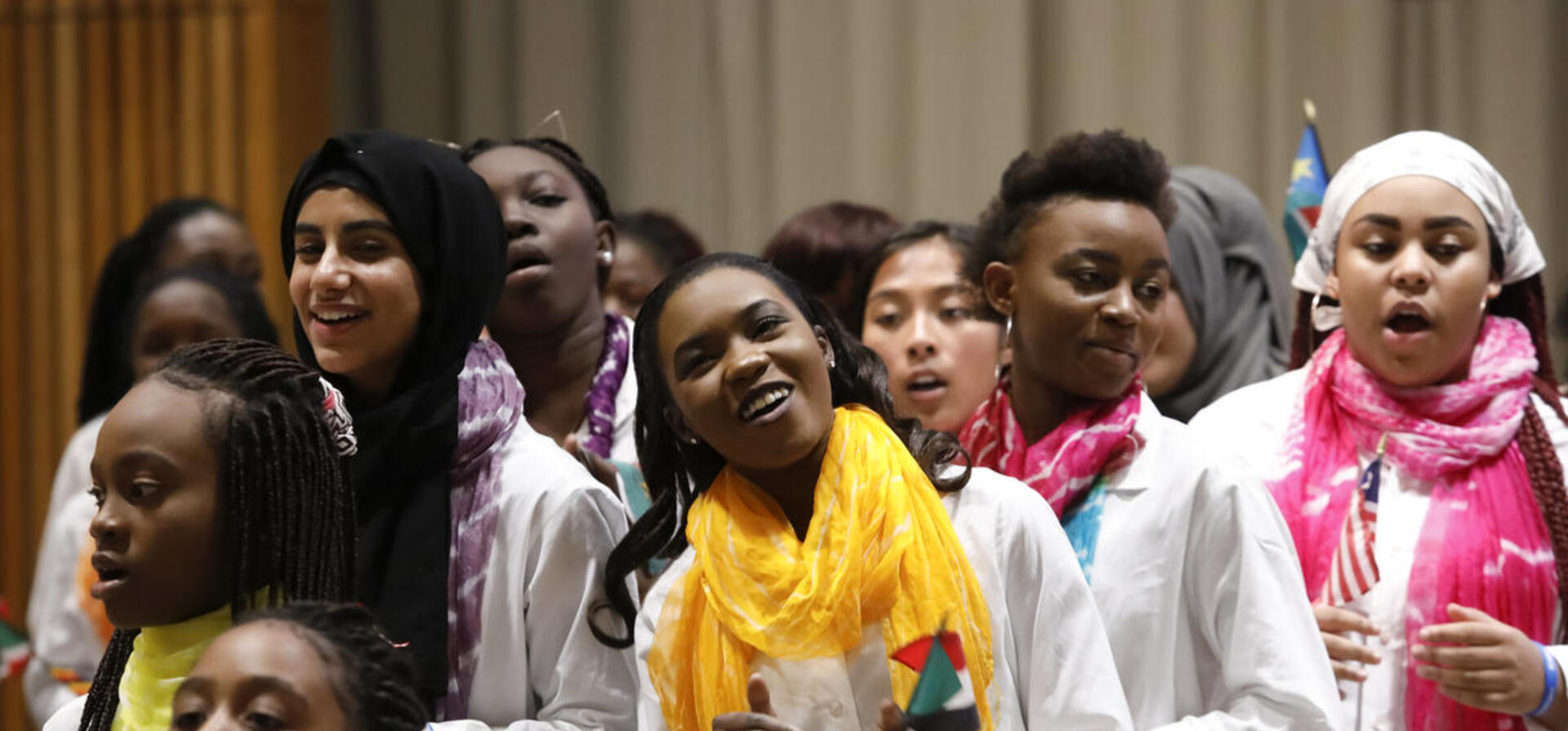 Refugee and immigrant girls from 19 countries unite their voices in one choir UNHCR photo