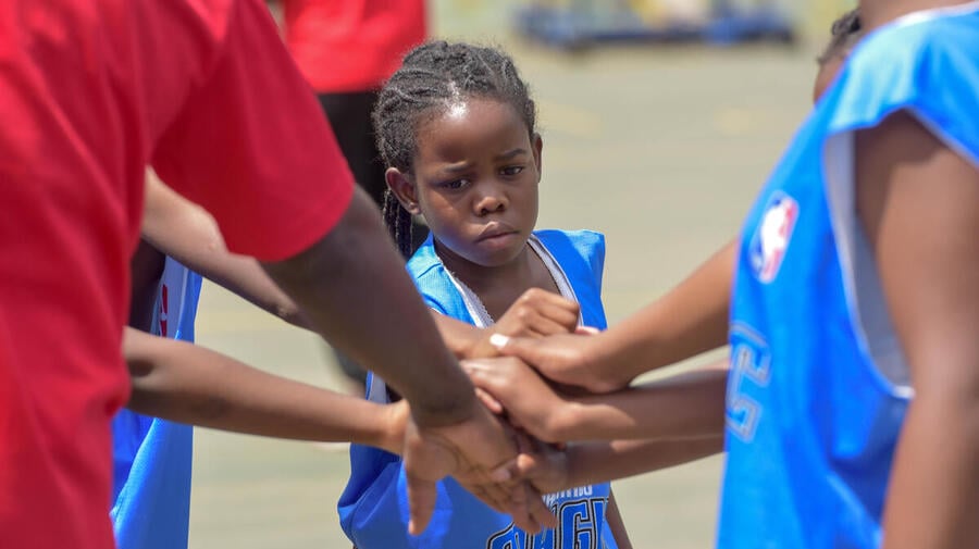 Young girl plays basketball