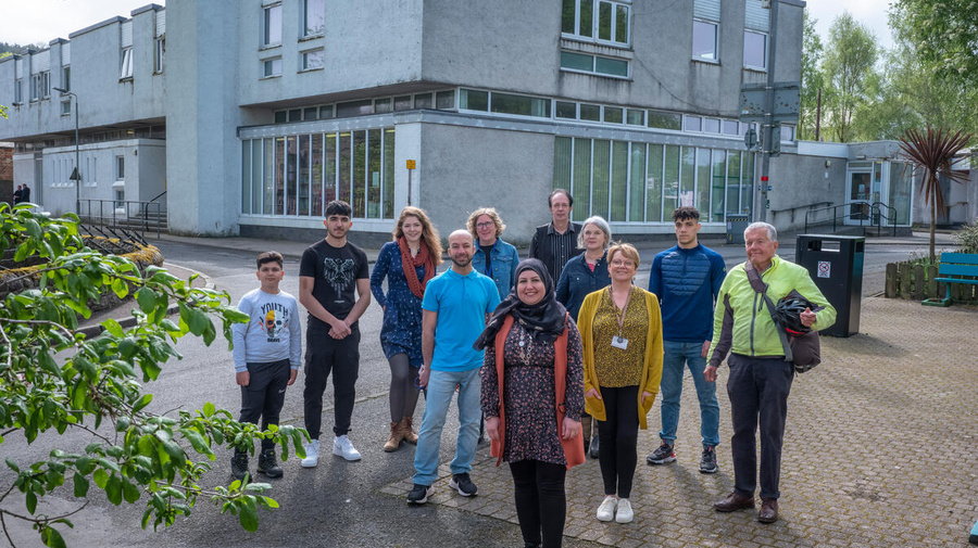 A group of people pictured outside the library in Rothesay